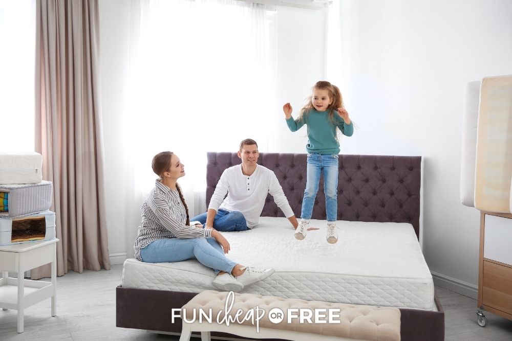 little girl jumping on bed with parents, from Fun Cheap or Free