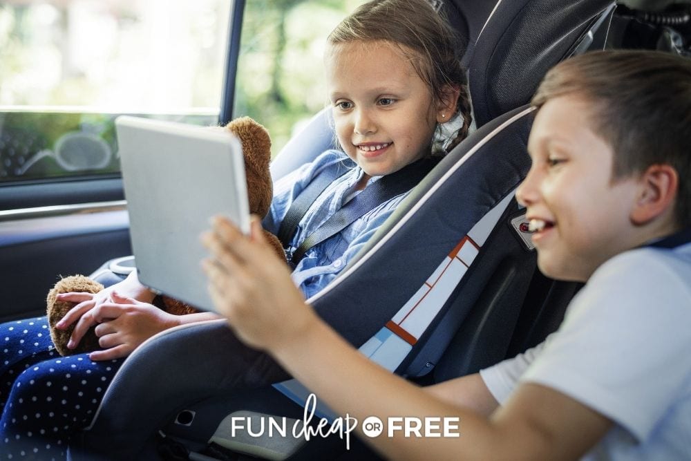 kids playing together in the back seat on a road trip, from Fun Cheap or Free