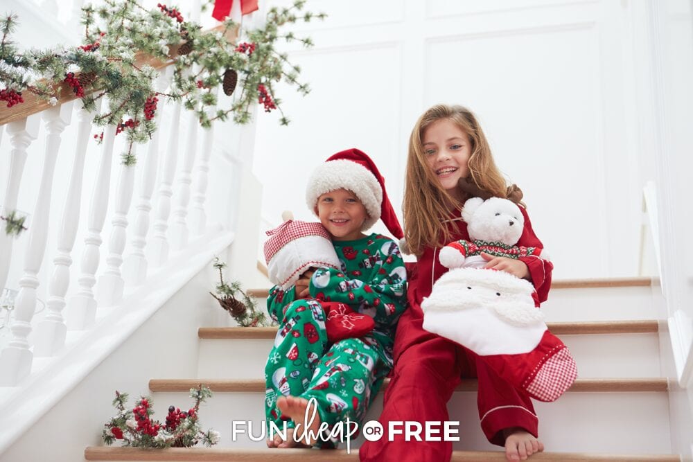 Kids sitting on the stairs holding stockings, from Fun Cheap or Free