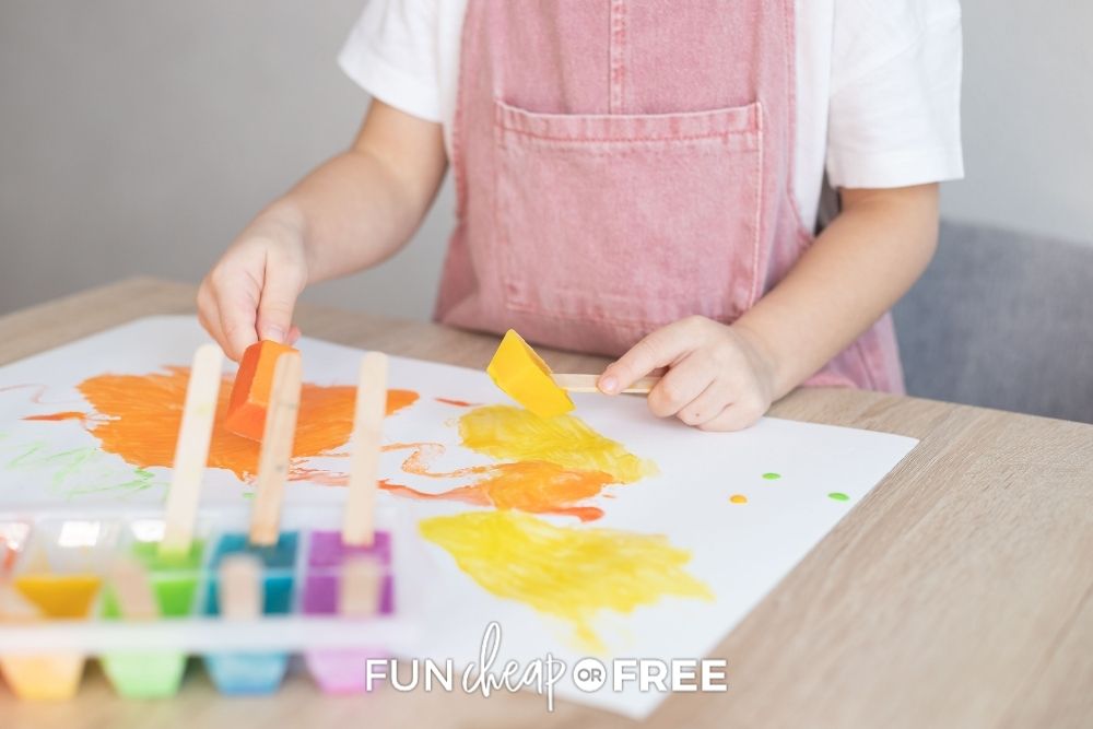 girl using DIY finger paint at home, from Fun Cheap or Free