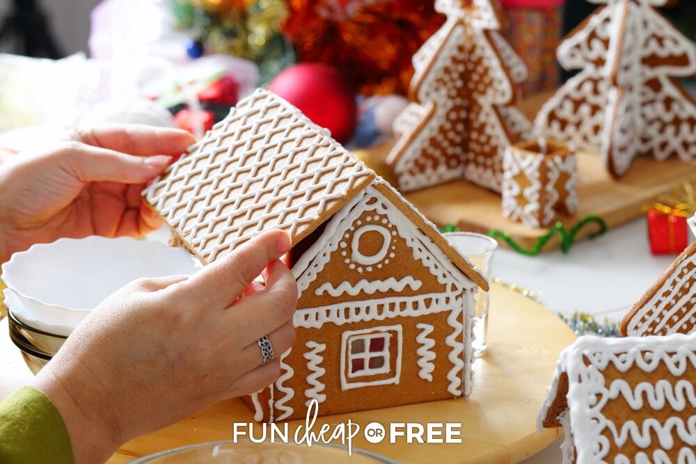 Hands putting together gingerbread house, from Fun Cheap or Free