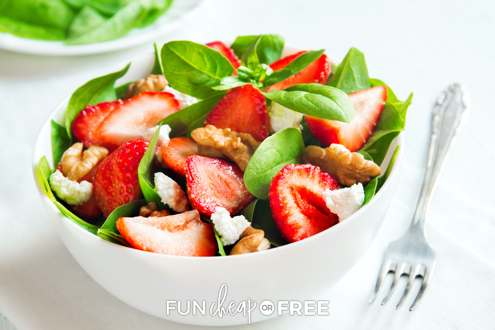 Strawberry spinach salad in a bowl, from Fun Cheap or Free