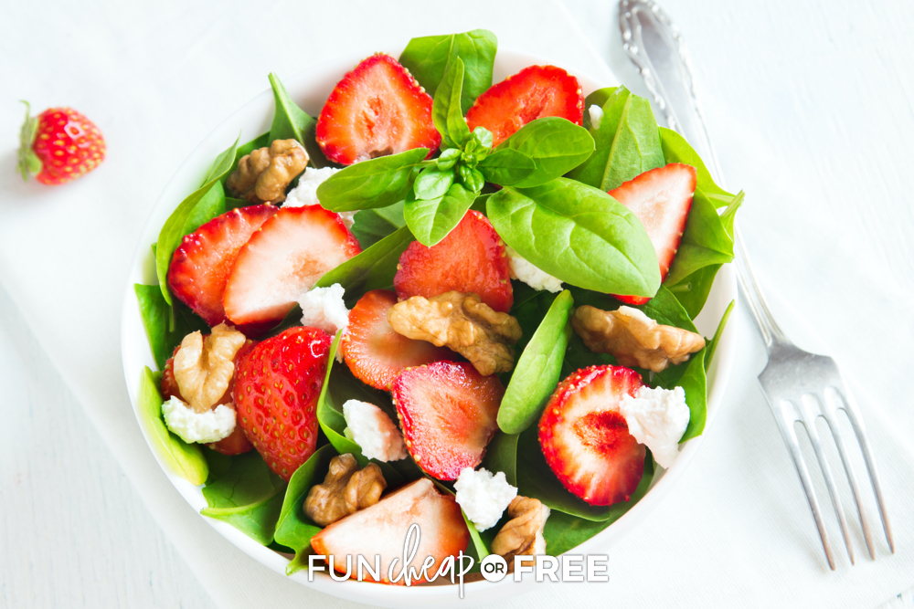 Strawberry spinach salad with walnuts in a bowl, from Fun Cheap or Free