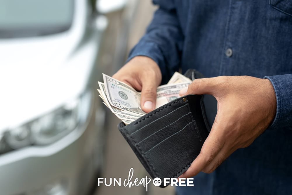 A man opening his wallet and pulling out cash, from Fun Cheap or Free.