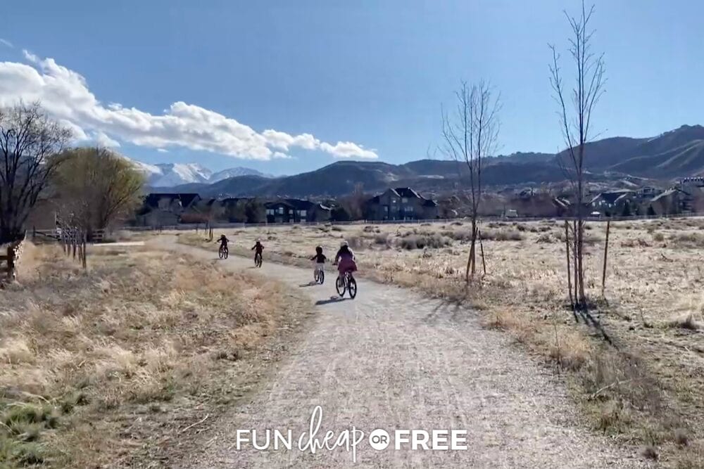 family riding bikes outside, from Fun Cheap or Free