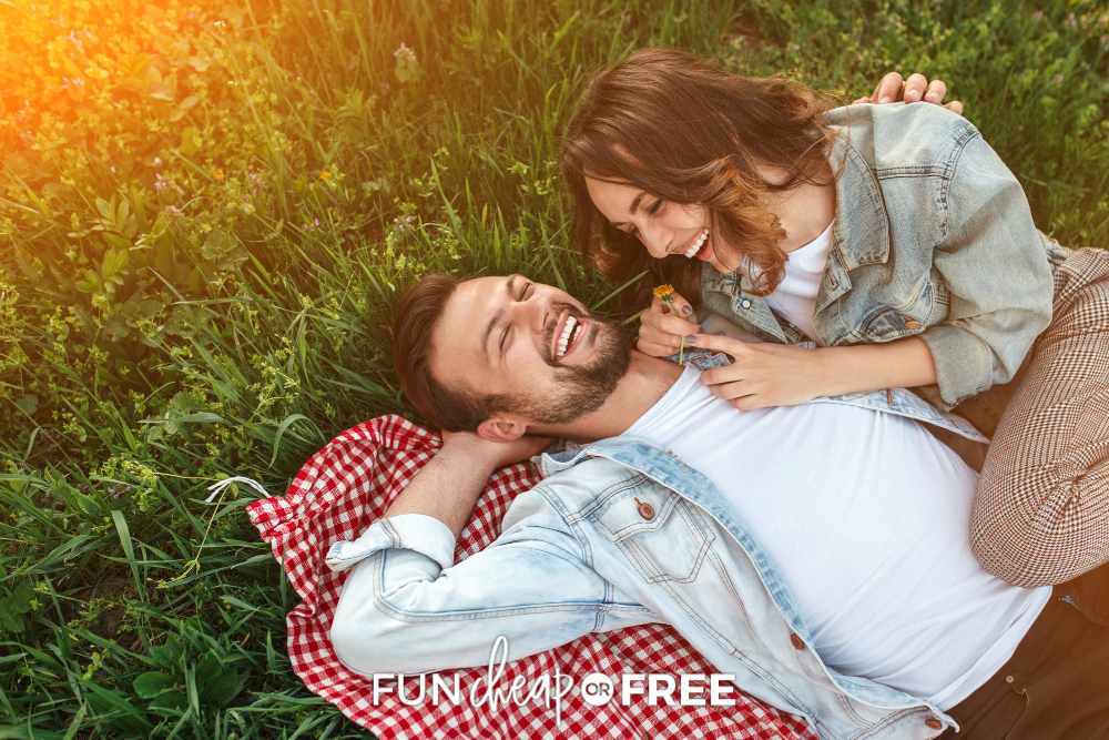 couple laying on a picnic blanket, from Fun Cheap or Free