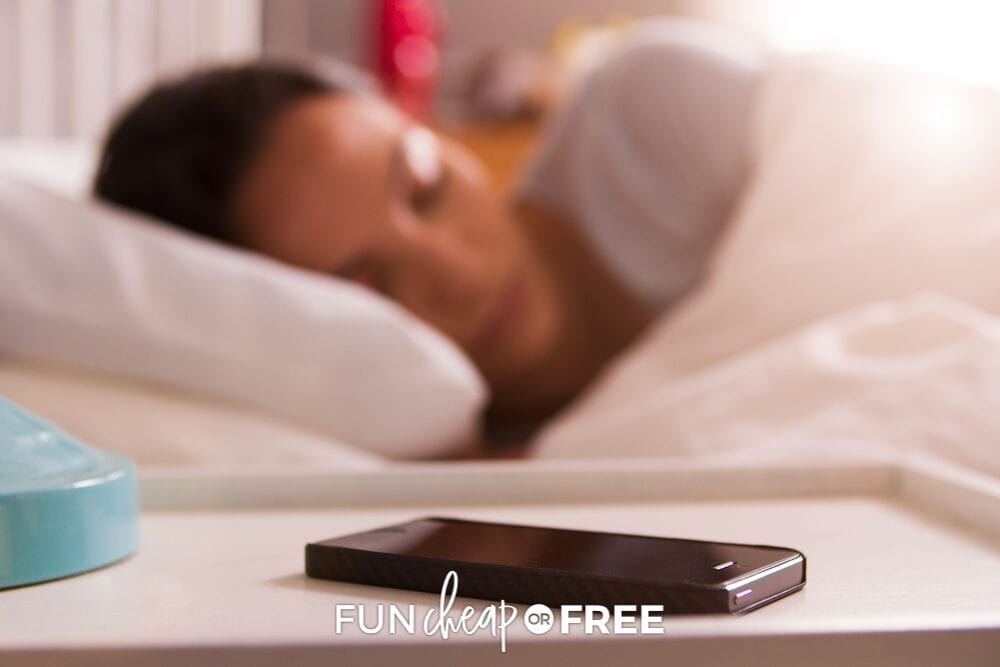 woman sleeping with phone on nightstand, from Fun Cheap or Free