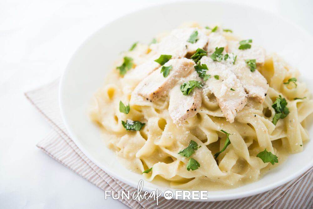 Sliced chicken over pasta on a plate, from Fun Cheap or Free