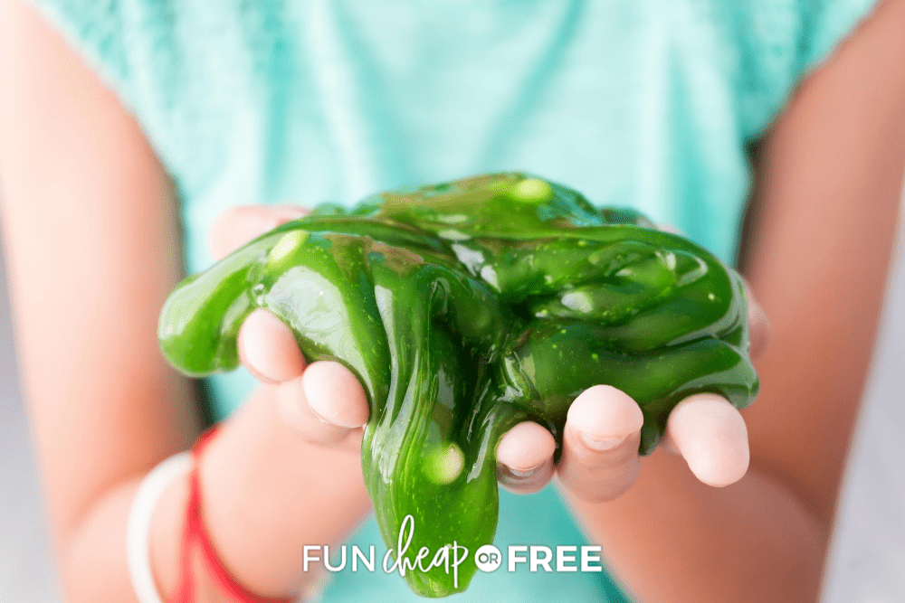 woman wearing green shirt holding green slime, from Fun Cheap or Free