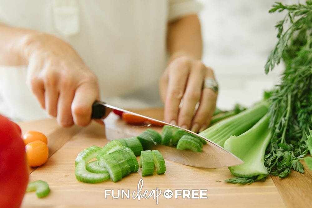 Jordan chopping celery on a cutting board, from Fun Cheap or Free