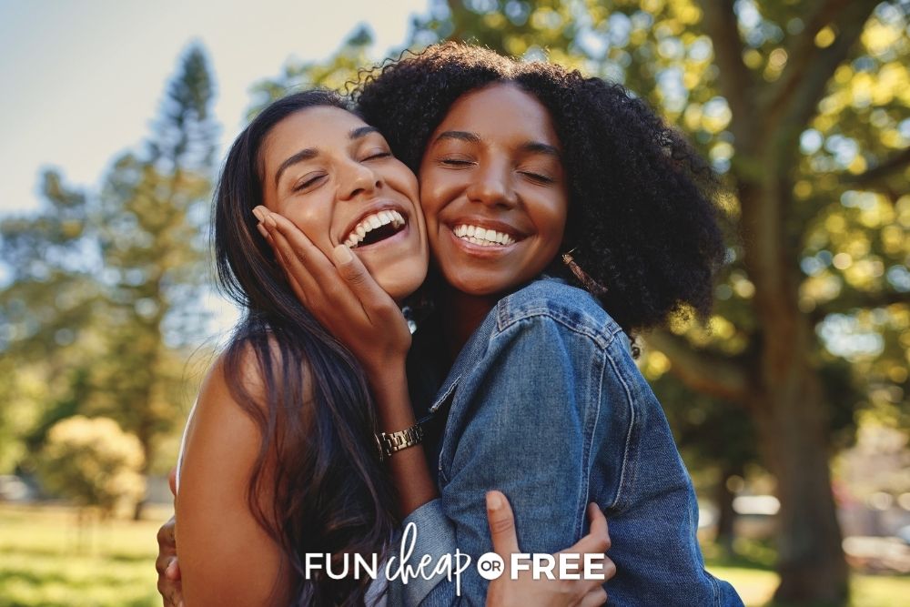 Two women hugging and smiling from Fun Cheap or Free. 