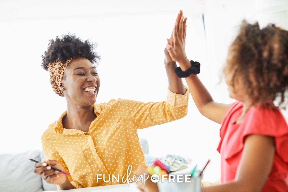 Mom and daughter giving a high five from Fun Cheap or Free.